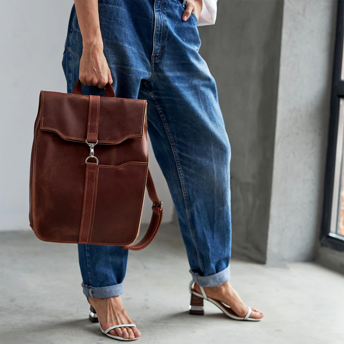Chestnut Vintage Rectangular Flap Backpack With Interlocking Ring Fastener, Front Slip Pocket And Integrated Top Hand Loop