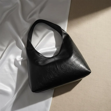 Oversized Triangular Hobo Pouch With Central Vertical Stitch Seam And Integrated Curved Underarm Grip Loop