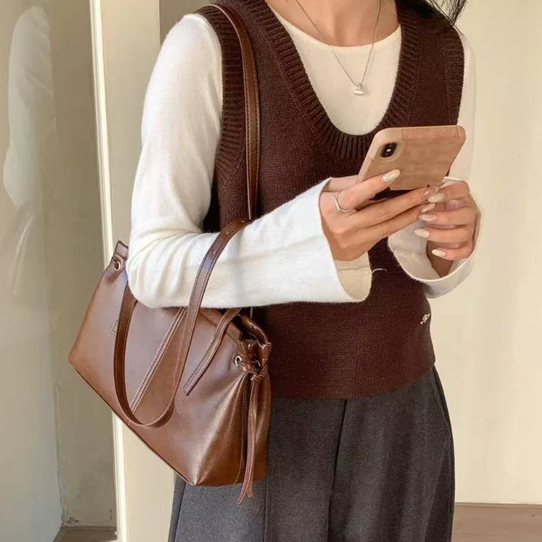 Dual Gloss Tone Streamlined Rectangular Underarm Pouch With Dual Vertical Stitch Tabs, Drawstring Tassel Details And Metallic Buckle Grip Strips
